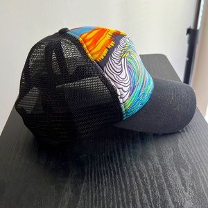 Snap back trucker hat with multi-color graphic.